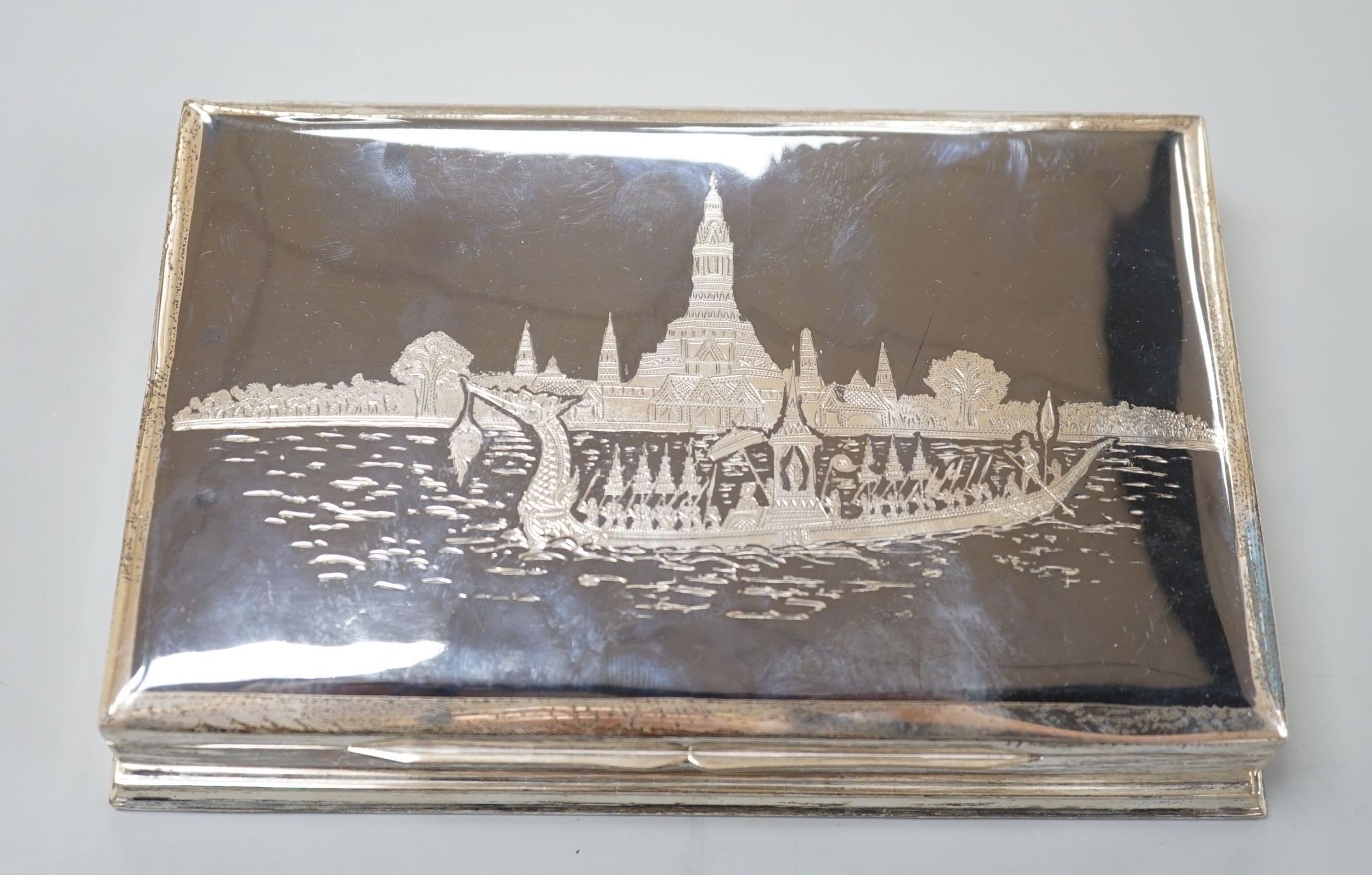 A Siamese sterling and niello cigarette box, 18.7cm.